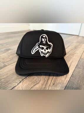 Black Trucker Hat with White Skull Graphic